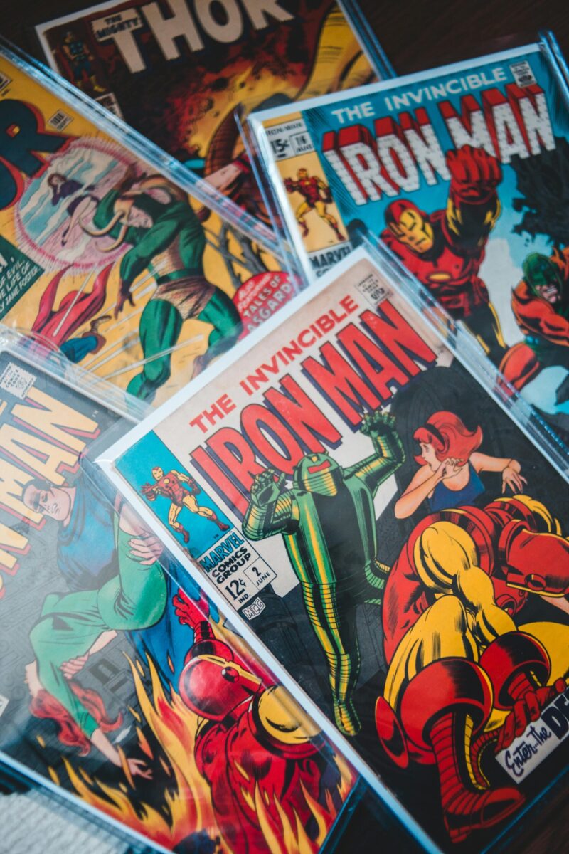 Close-up shot of vibrant vintage comic books featuring Iron Man and Thor.